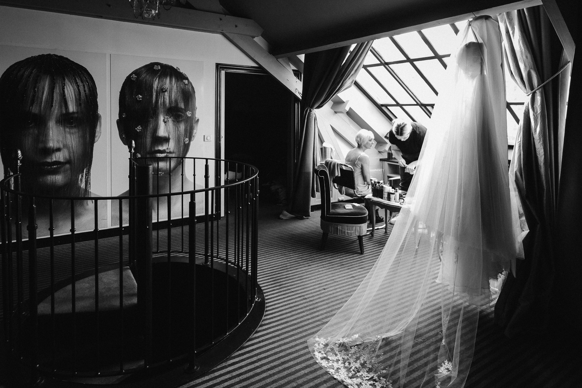Paris wedding photographer: The Suzanne Neville dress is hanging in the Eiffel suite of Hotel Particulier in Montmartre, Paris